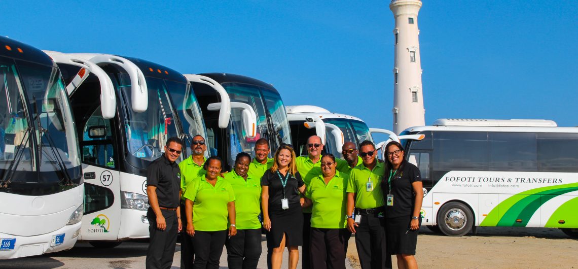FOFOTI_natural_pool_the-Arikok-National-Park_UTV-TOURS-1140×530 a group of people standing in front of a bus